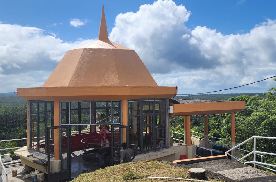 Temple shikhara under open sky — Centennial Magazine